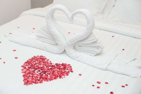 Spread Rose Petals on The Bed